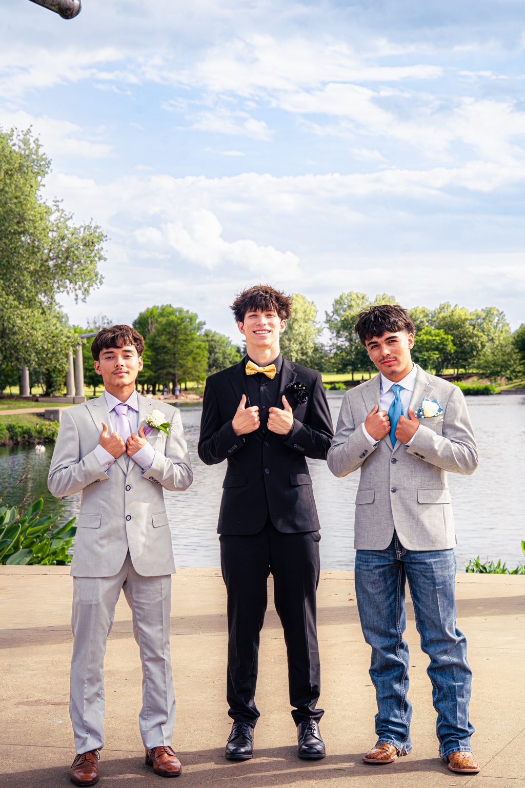 Three friends dressed for a special occasion outdoors