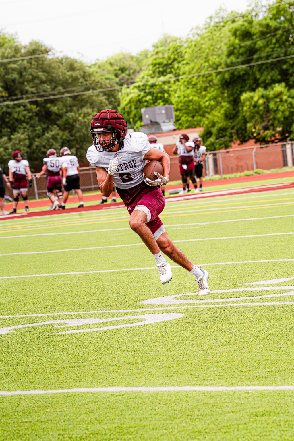 Football player catching a ball during a game